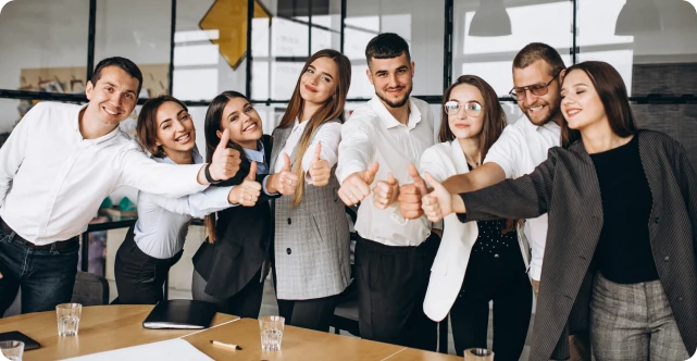 Team members giving thumbs up