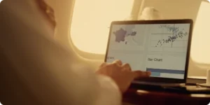 Person analyzing air freight performance metrics on a BI dashboard, focusing on key indicators for CargoWise users.