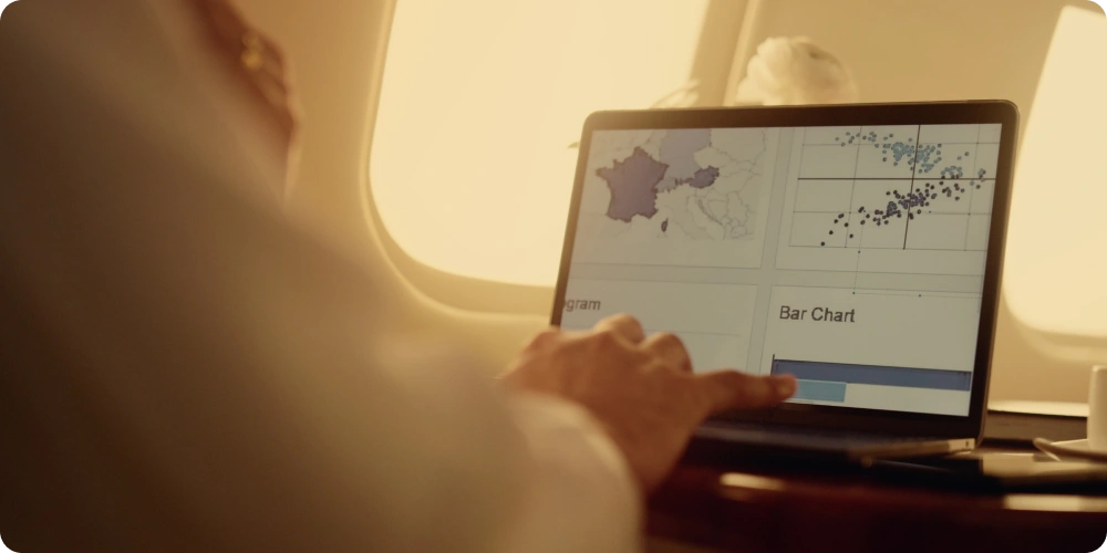 Person analyzing air freight performance metrics on a BI dashboard, focusing on key indicators for CargoWise users.